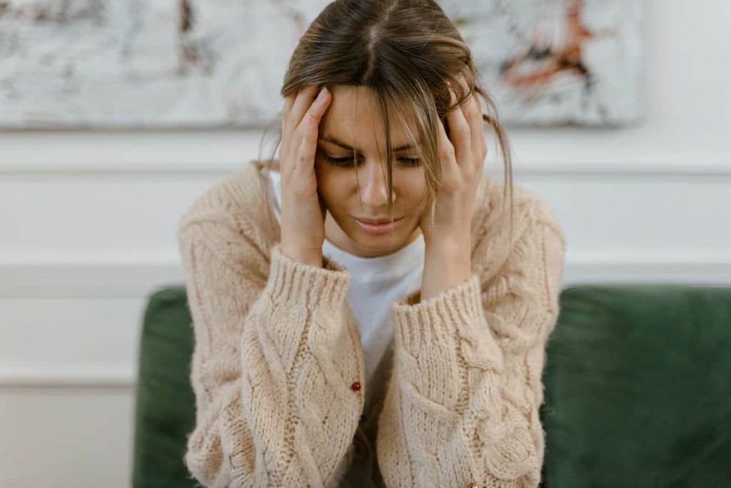 A person distracted by persistent thoughts during an ordinary activity.
