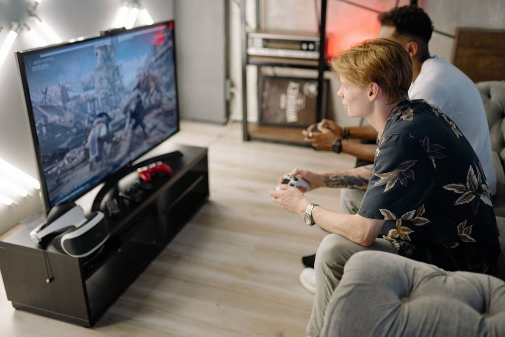 A person focused on playing a video game