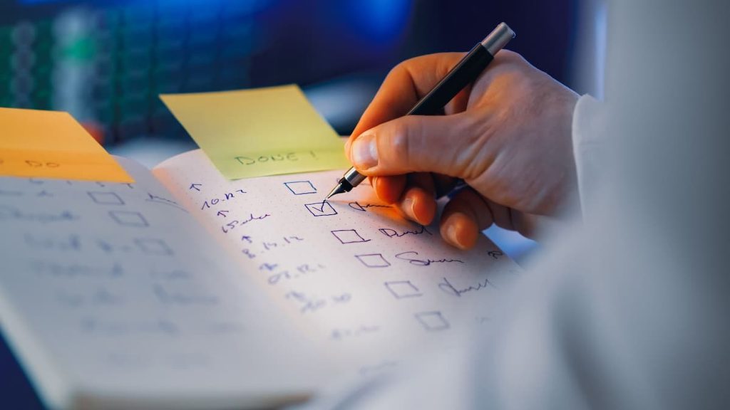 An employee organizing tasks with a checklist