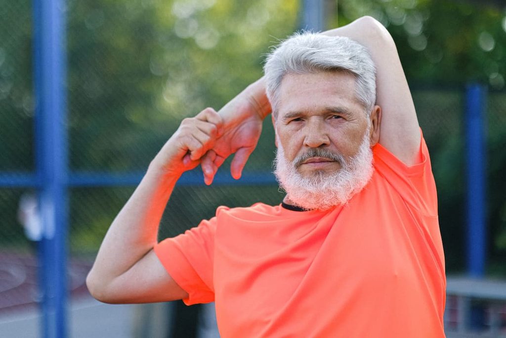 Older adult practicing a gentle shoulder mobility exercise